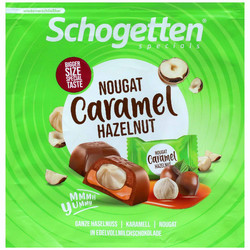 Продуктови Категории Шоколади Schogetten Specials 15 индивидуално опаковани парчета фин млечен шоколад с пълнеж от нуга, карамел и цял лешник